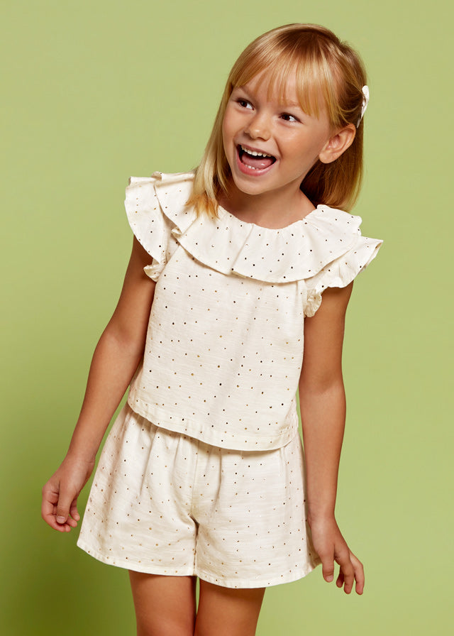 Conjunto blusa y bermuda.