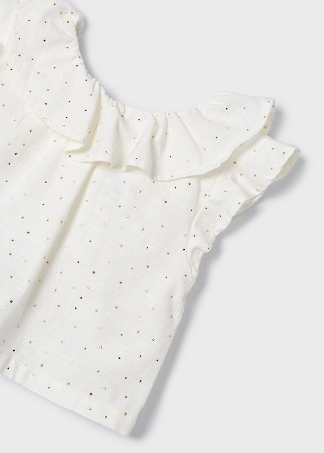 Conjunto blusa y bermuda.