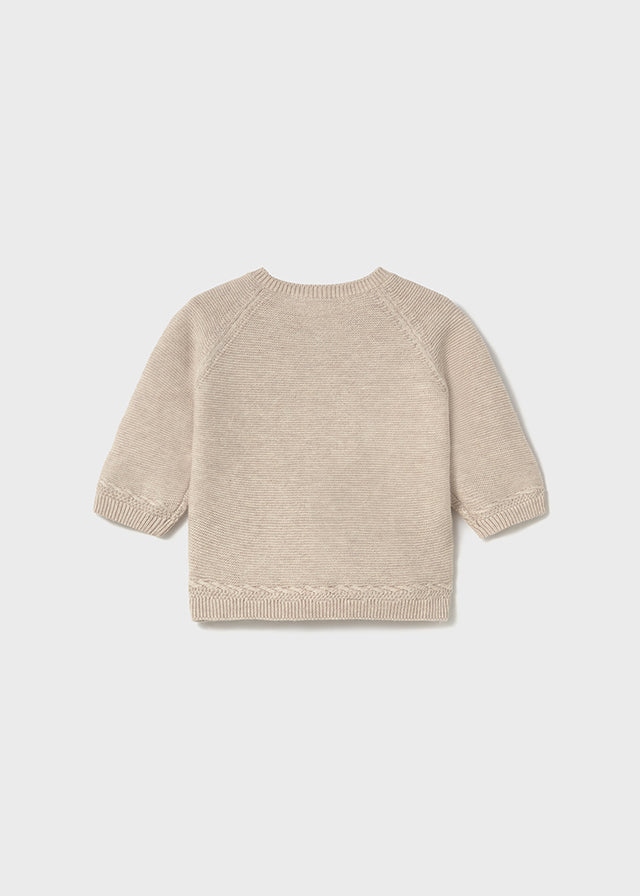 Cardigan tricot en color beig.